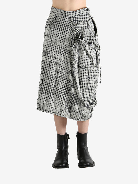 White skirts worn by a person, showing the skirts fit