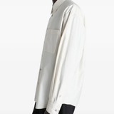 white shirts worn by a person, showing the shirts fit