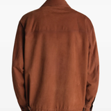 Brown jackets-coats worn by a person, showing the jackets-coats's fit