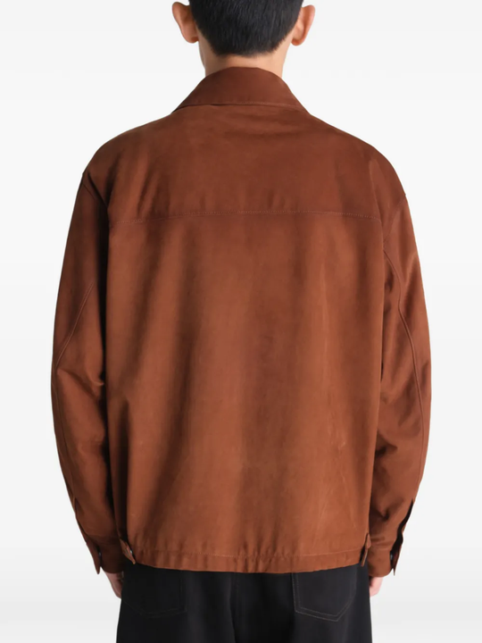 Brown jackets-coats worn by a person, showing the jackets-coats's fit