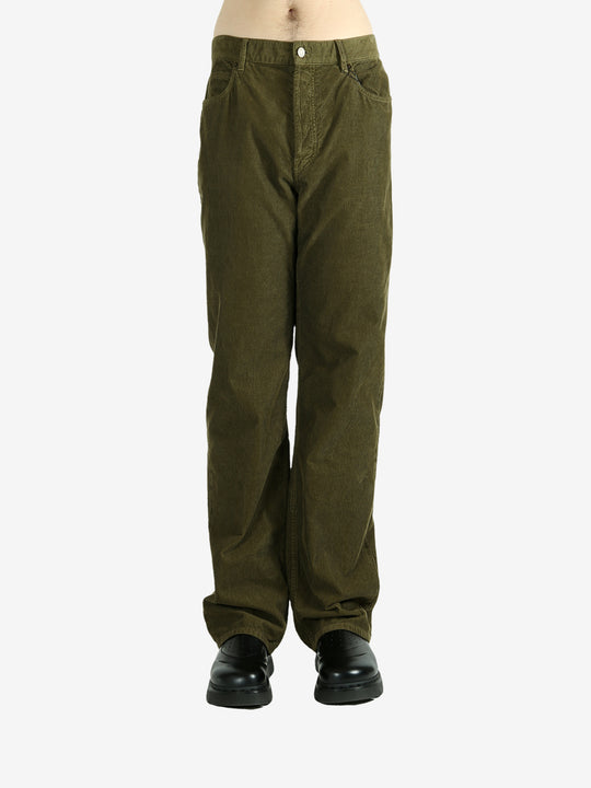 Green pants worn by a person, showing the pants's fit
