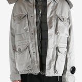 Grey jacket worn by a person, showing the jacket's fit