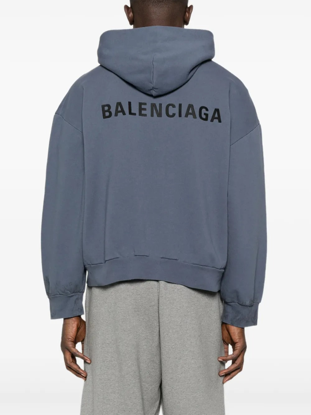 Blue hoodie worn by a person, showing the hoodie's fit