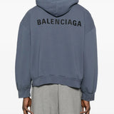 Blue hoodie worn by a person, showing the hoodie's fit