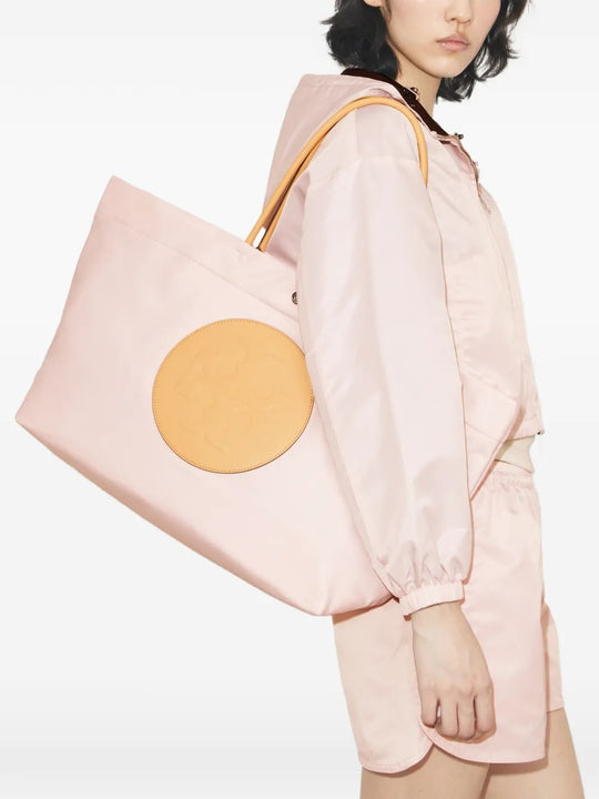 Pink bags worn by a person, showing the bags' fit 