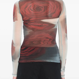 White top worn by a person, showing the top's fit