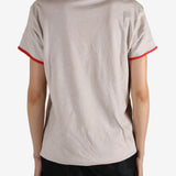 White t-shirt worn by a person, showing the shirt's fit