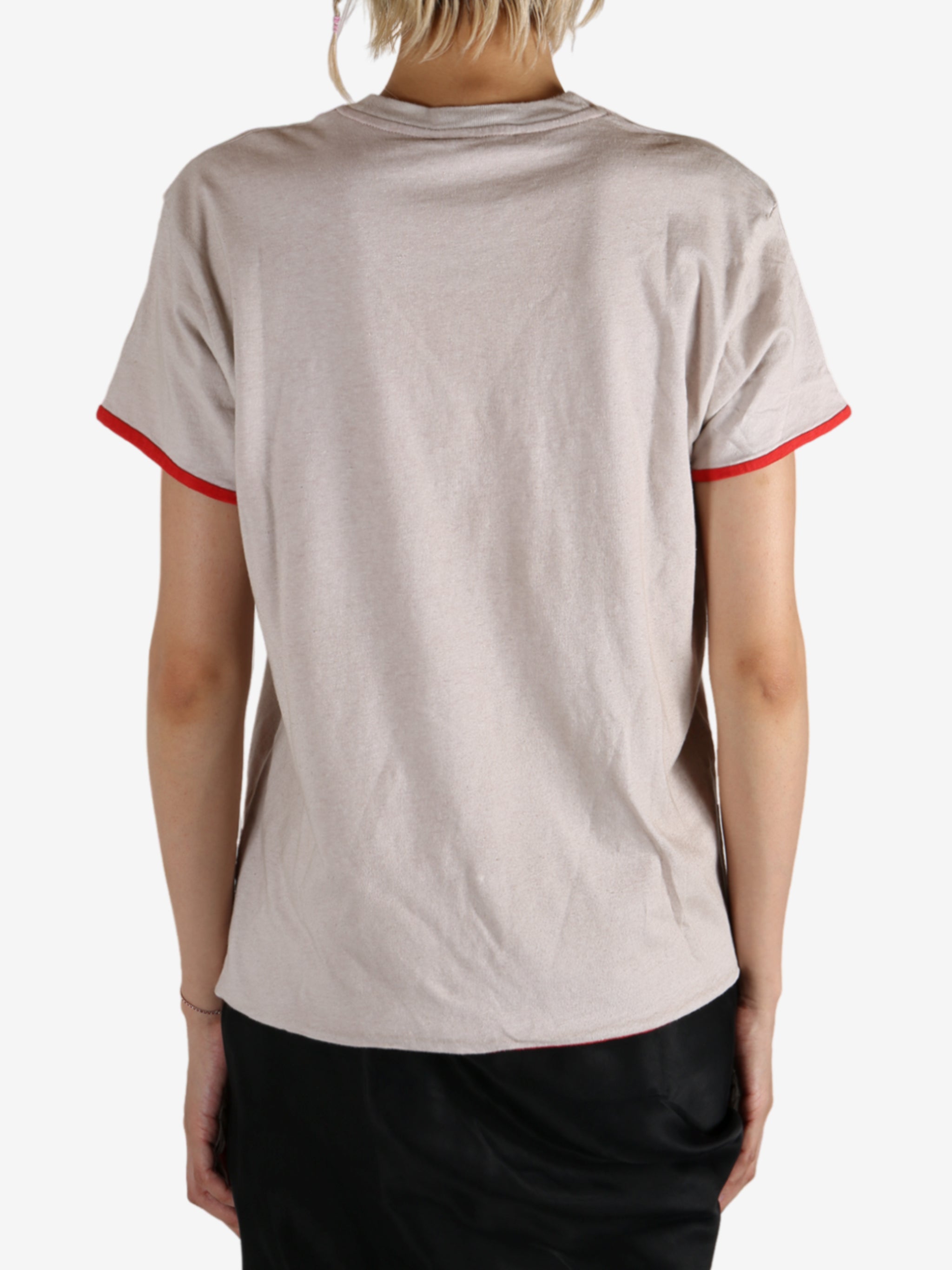 White t-shirt worn by a person, showing the shirt's fit