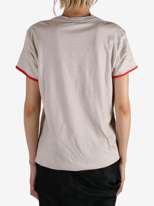 White t-shirt worn by a person, showing the shirt's fit