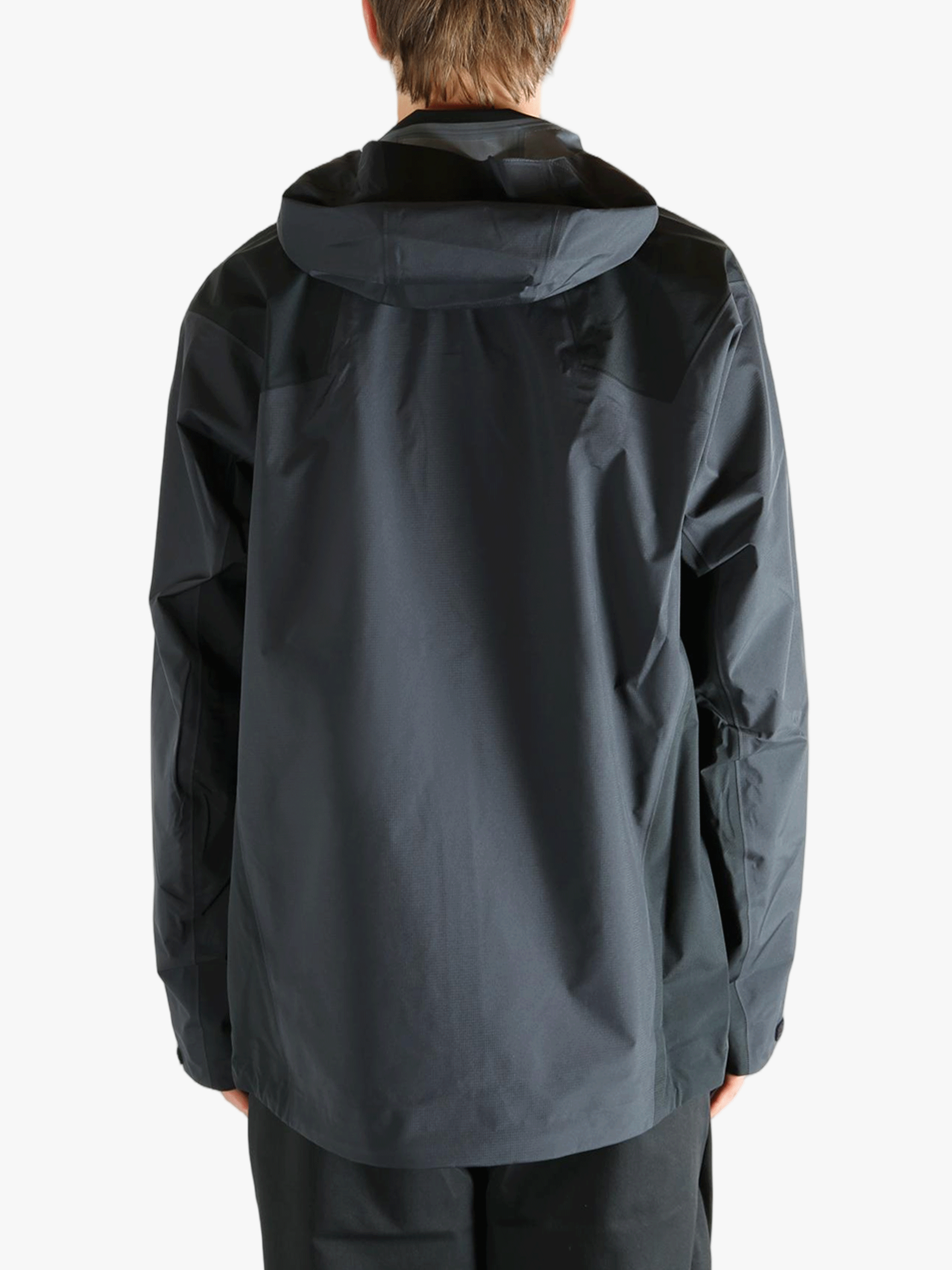 Black jacket worn by a person, showing the  jacket's fit