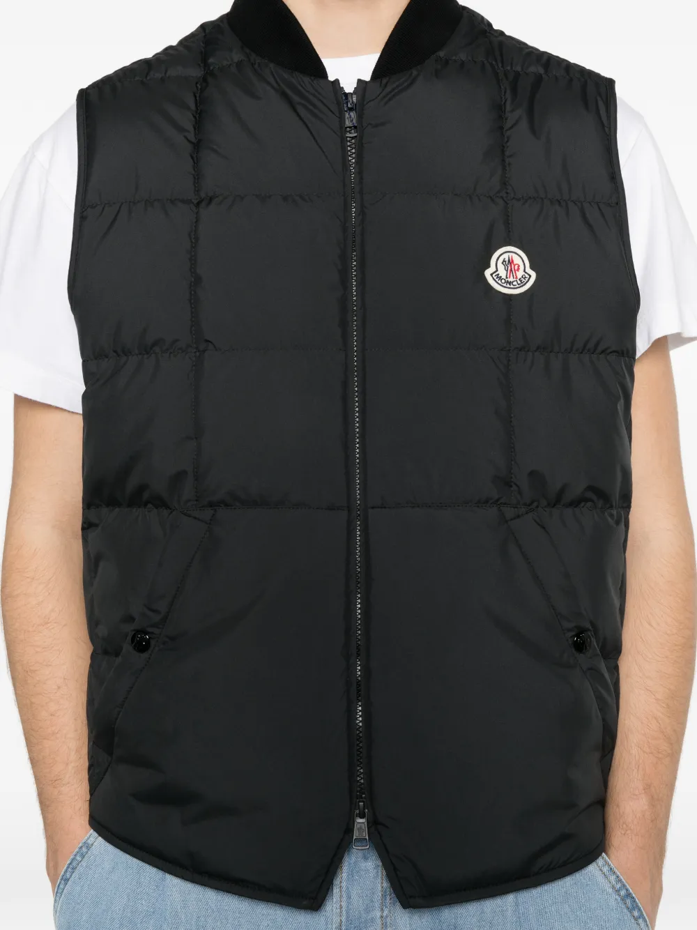 Black jackets-coats worn by a person, showing the jackets-coats's fit