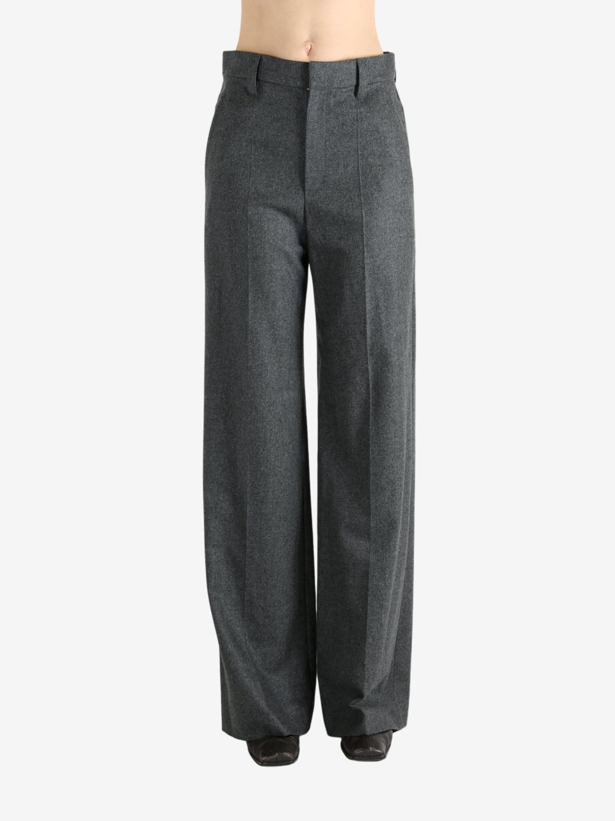 Grey pants worn by a person, showing the pants fit