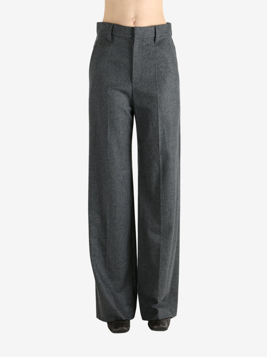 Grey pants worn by a person, showing the pants fit