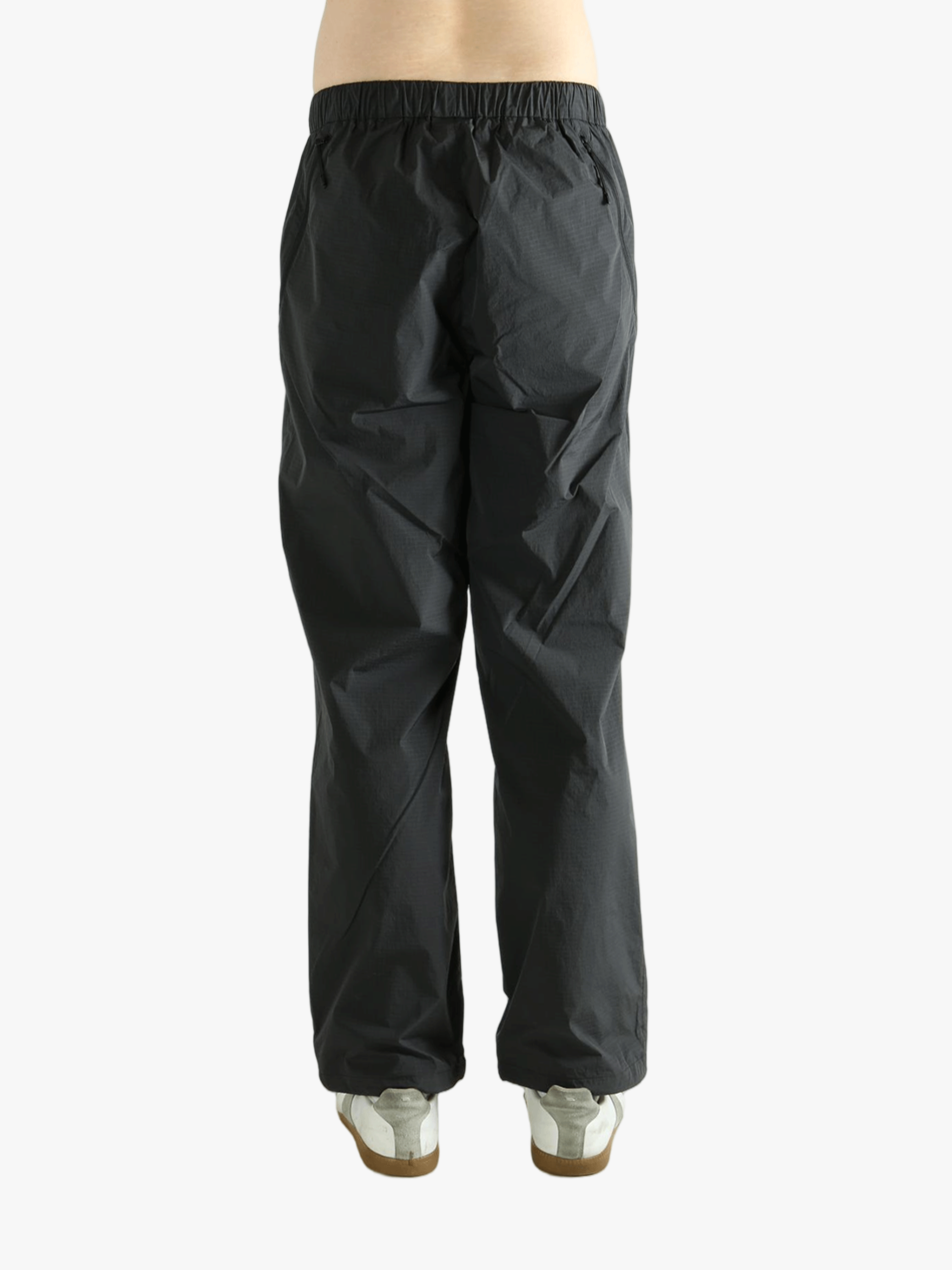 Grey pant worn by a person, showing the pant's fit
