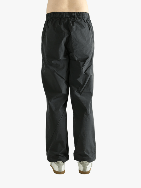 Grey pant worn by a person, showing the pant's fit