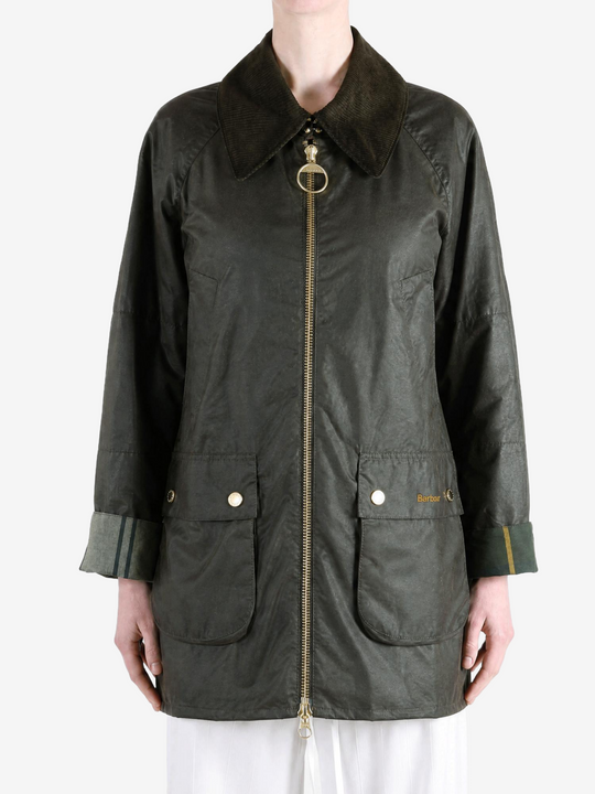 Green jacket worn by a person, showing the jacket fit