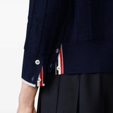 Close up of the navy knitwear, showing texture of the wool fabric