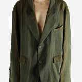 Green blazer worn by a person, showing the blazer's fit