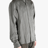 Grey shirt worn by a person, showing the shirt's fit