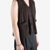 Brown vest worn by a person, showing the vest's fit