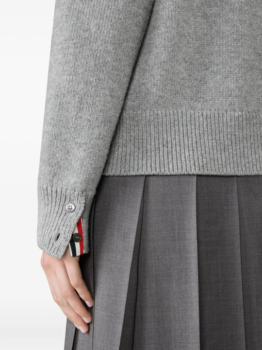 Close up of grey knitwear, showing texture of the Wool fabric