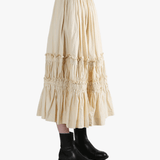 Beige tiered skirt worn by a person, showing the skirt fit