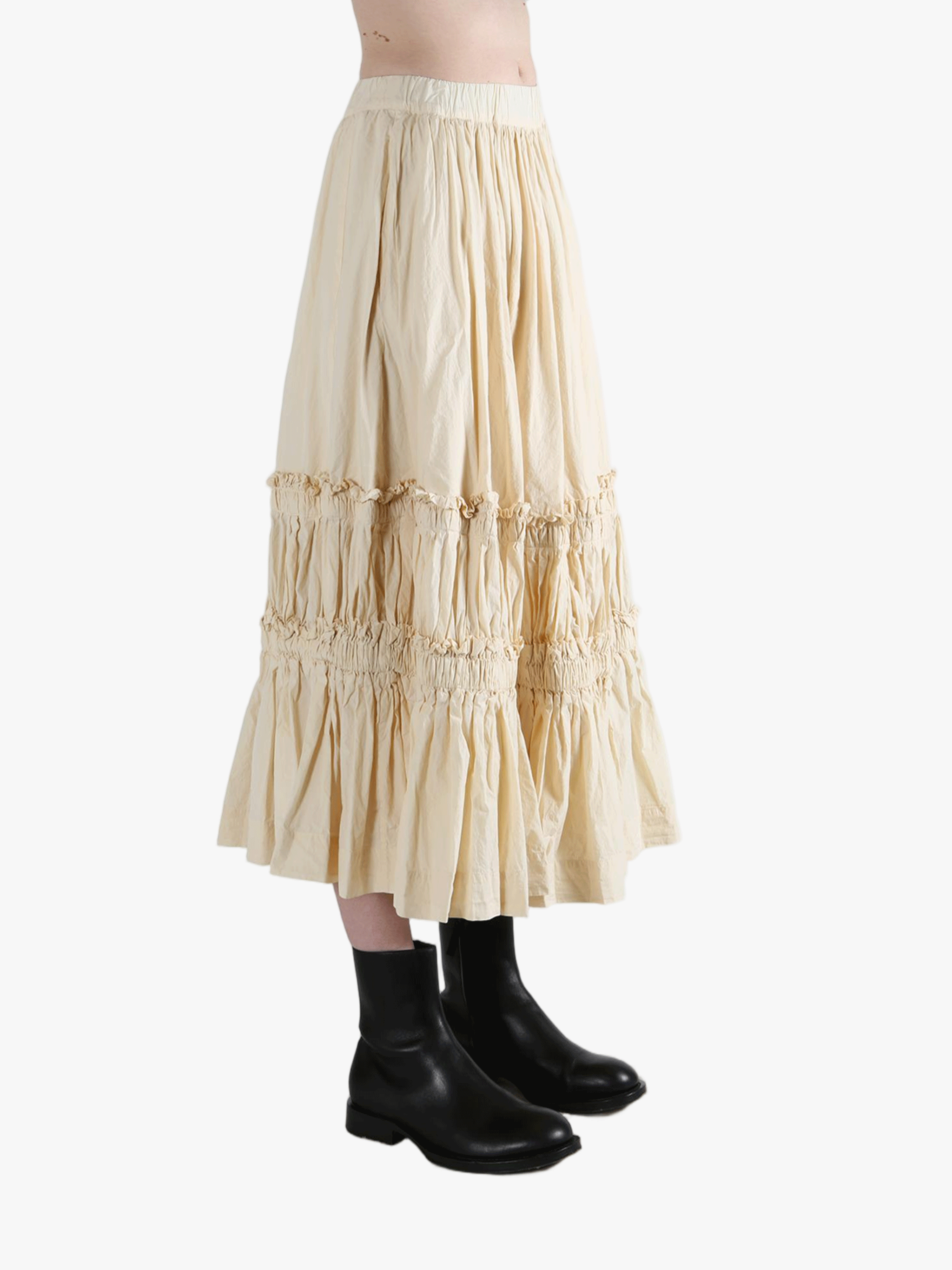 Beige tiered skirt worn by a person, showing the skirt fit
