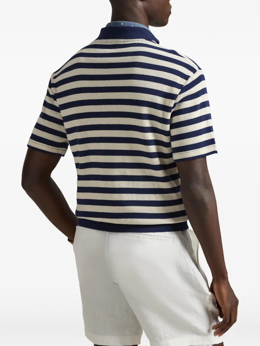 Blue shirt worn by a person, showing the shirt's fit