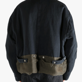 Black jacket worn by a person, showing the jacket's fit
