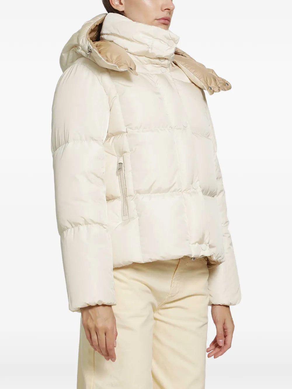 White jacket worn by a person, showing the jacket fit