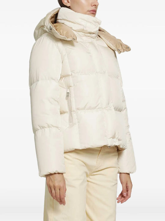 White jacket worn by a person, showing the jacket fit