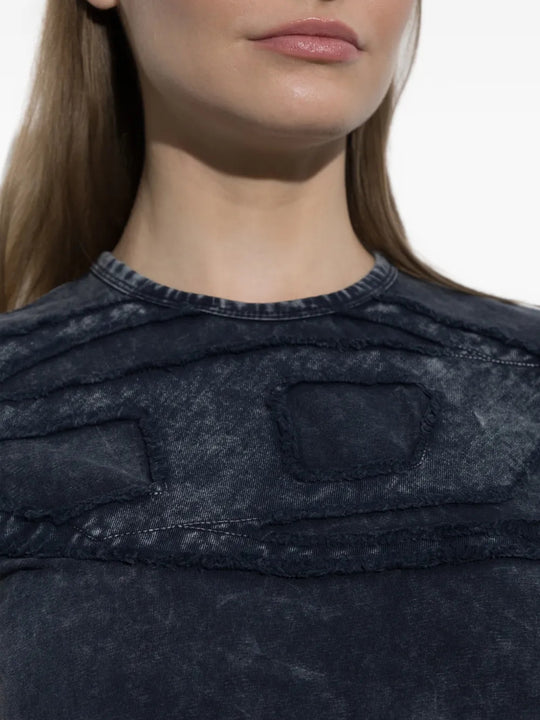 Navy top worn by a person, showing the top fit