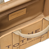 close up of brown bags, showing texture of the suede cow leather fabric