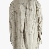 Grey shirt worn by a person, showing the shirt's fit