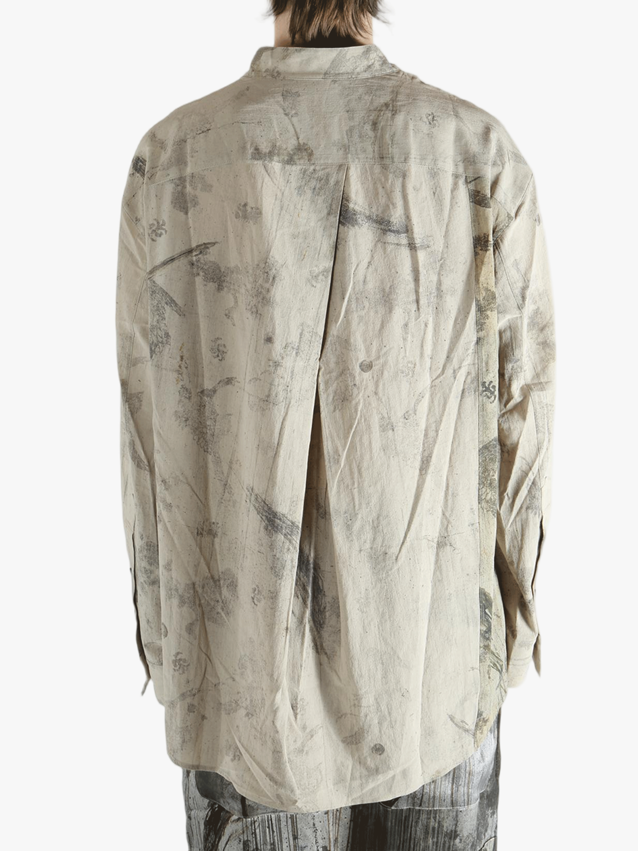 Grey shirt worn by a person, showing the shirt's fit