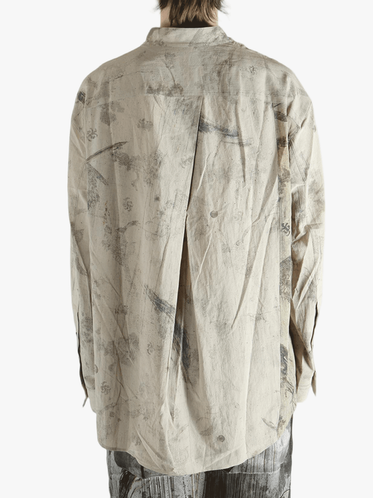 Grey shirt worn by a person, showing the shirt's fit