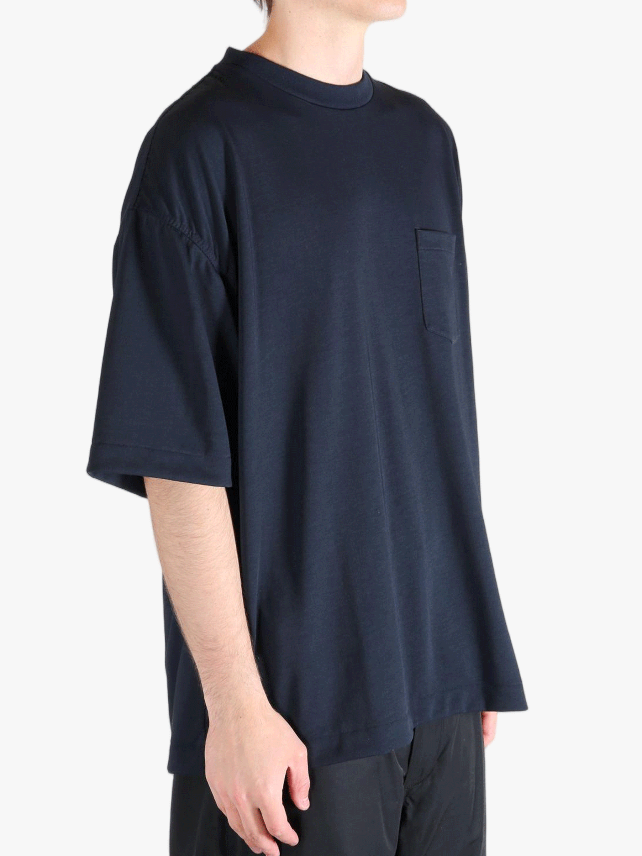 Navy t-shirt worn by a person, showing the t-shirt's fit