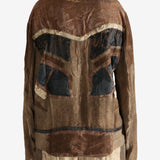 Brown jacket worn by a person, showing the jacket fit