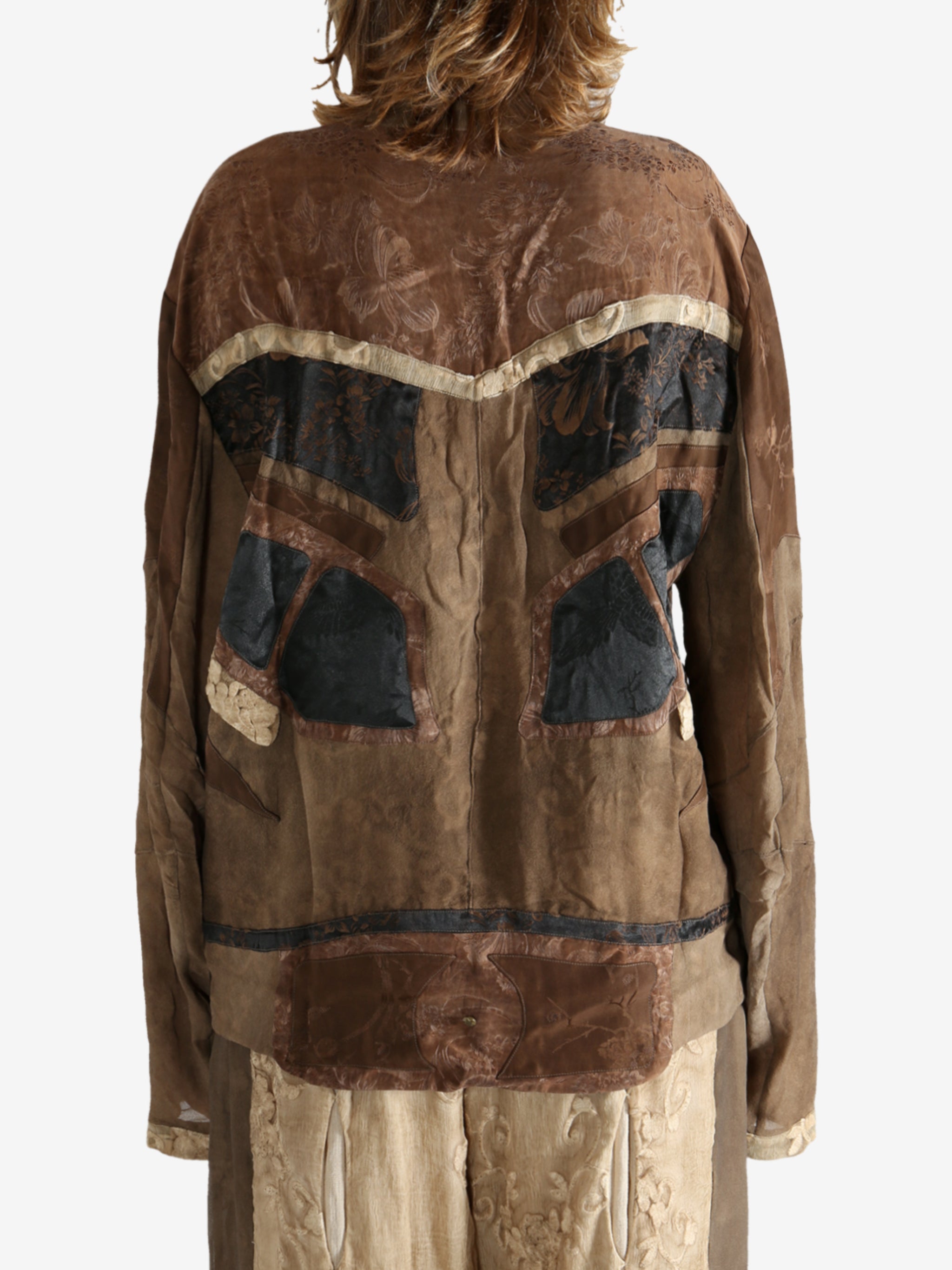 Brown jacket worn by a person, showing the jacket fit