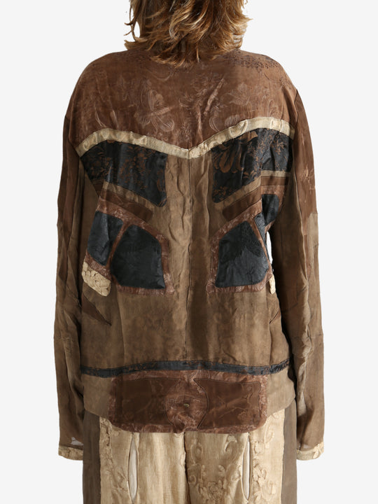 Brown jacket worn by a person, showing the jacket fit