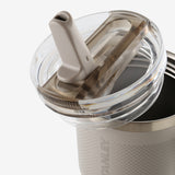 Close up of grey tumbler, showing texture of the stainless steel fabric