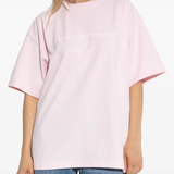 Pink t-shirt worn by a person, showing the shirt's fit