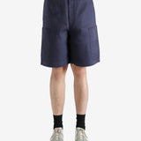 Navy shorts worn by a person, showing the shorts fit
