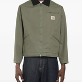 Green jackets-coats, worn by a person, showing the jackets-coats fit