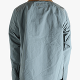 Blue jacket worn by a person, showing the jacket fit