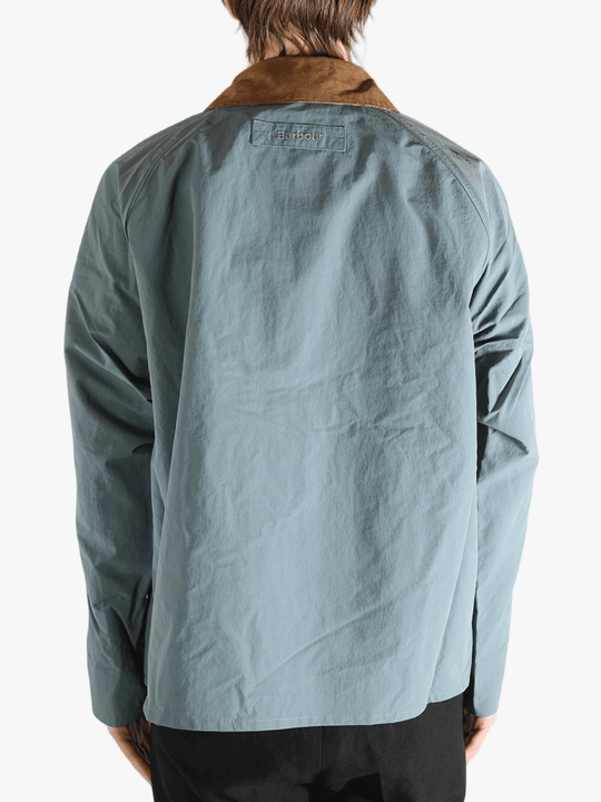 Blue jacket worn by a person, showing the jacket fit