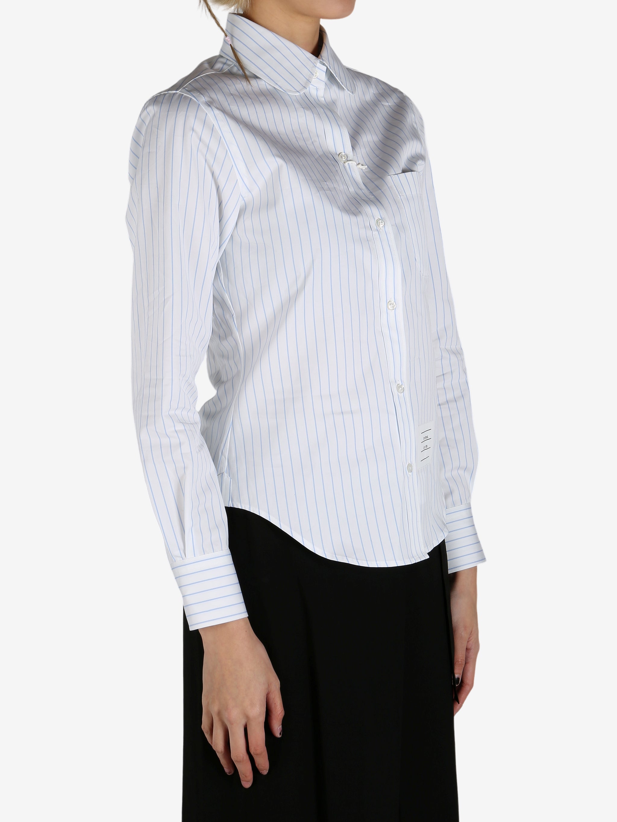 Blue shirt worn by a person, showing the shirt's fit