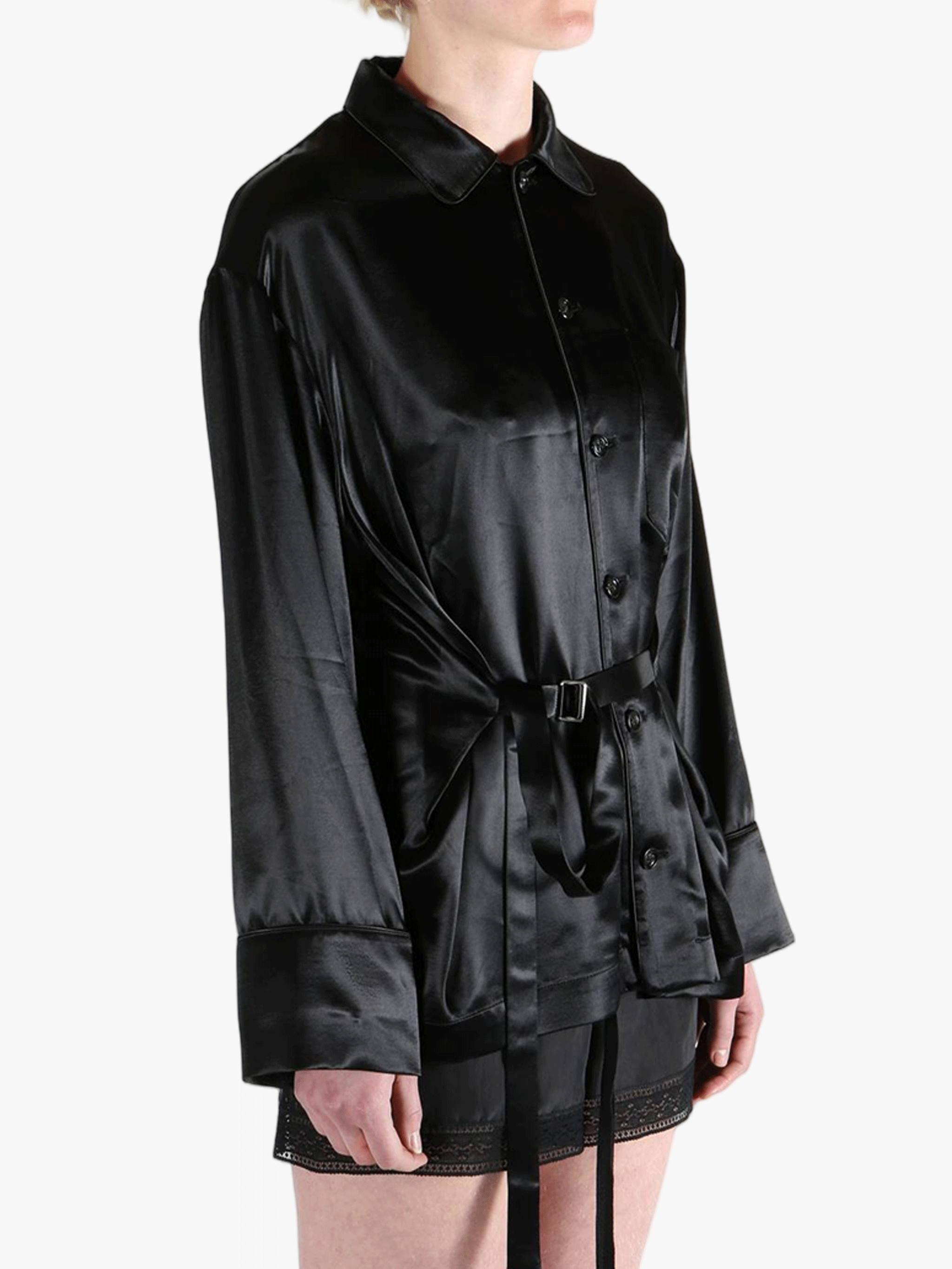 Black top worn by a person, showing the top's fit