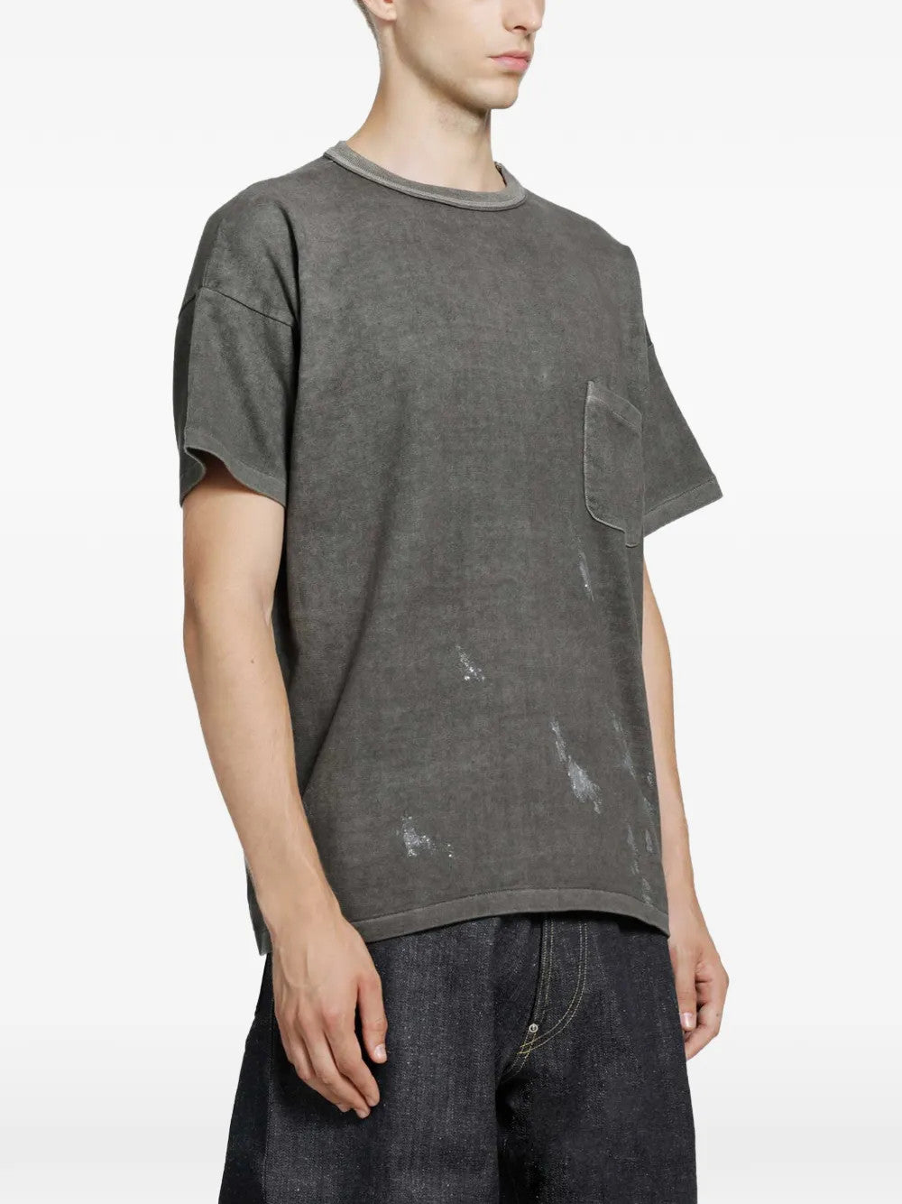 Grey t-shirt worn by a person, showing the t-shirt fit