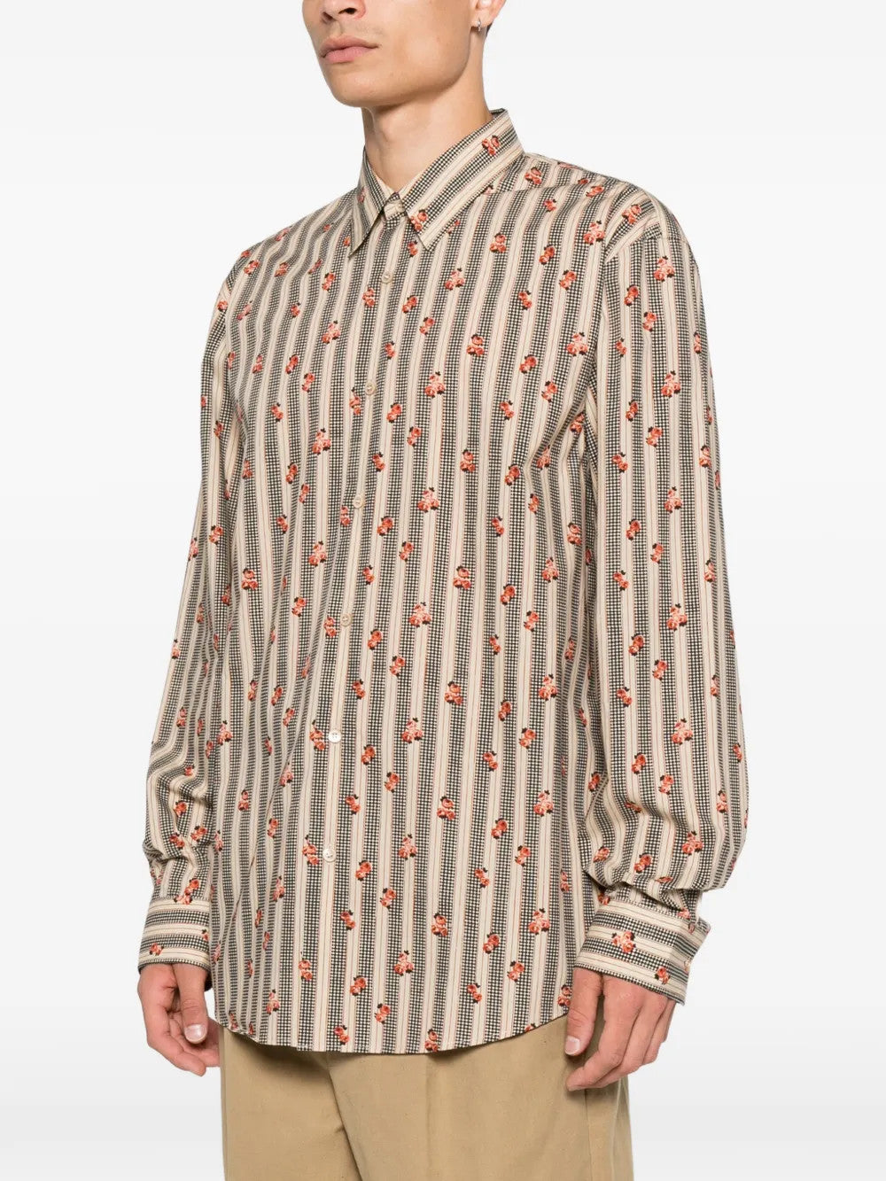 Tan shirt worn by a person, showing the shirt fit
